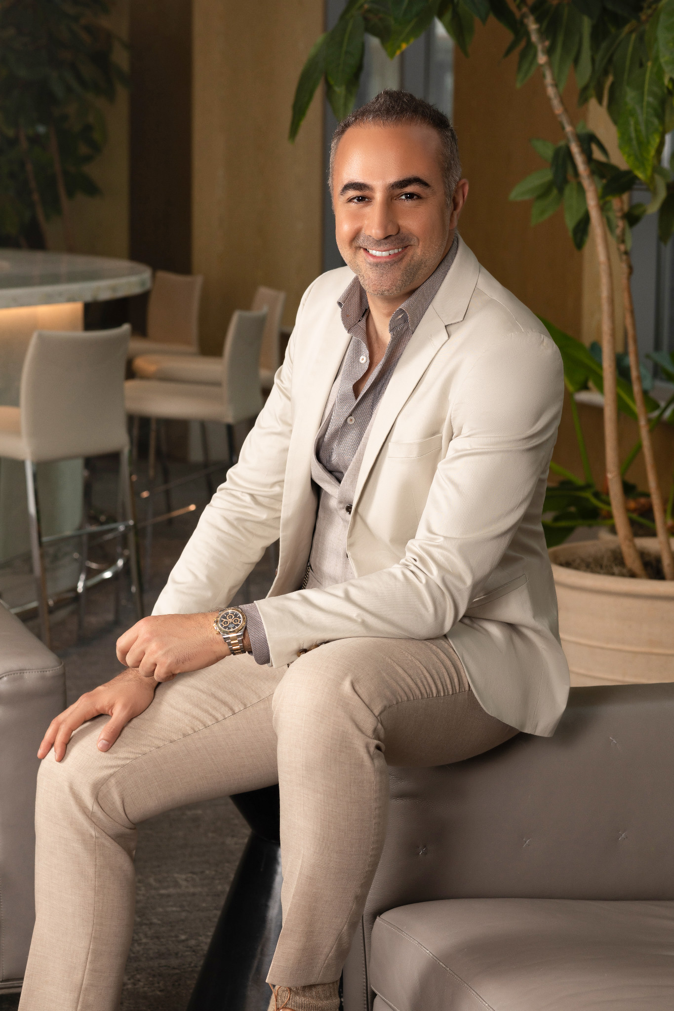 Sepehr Irandoost seated in a cream jacket